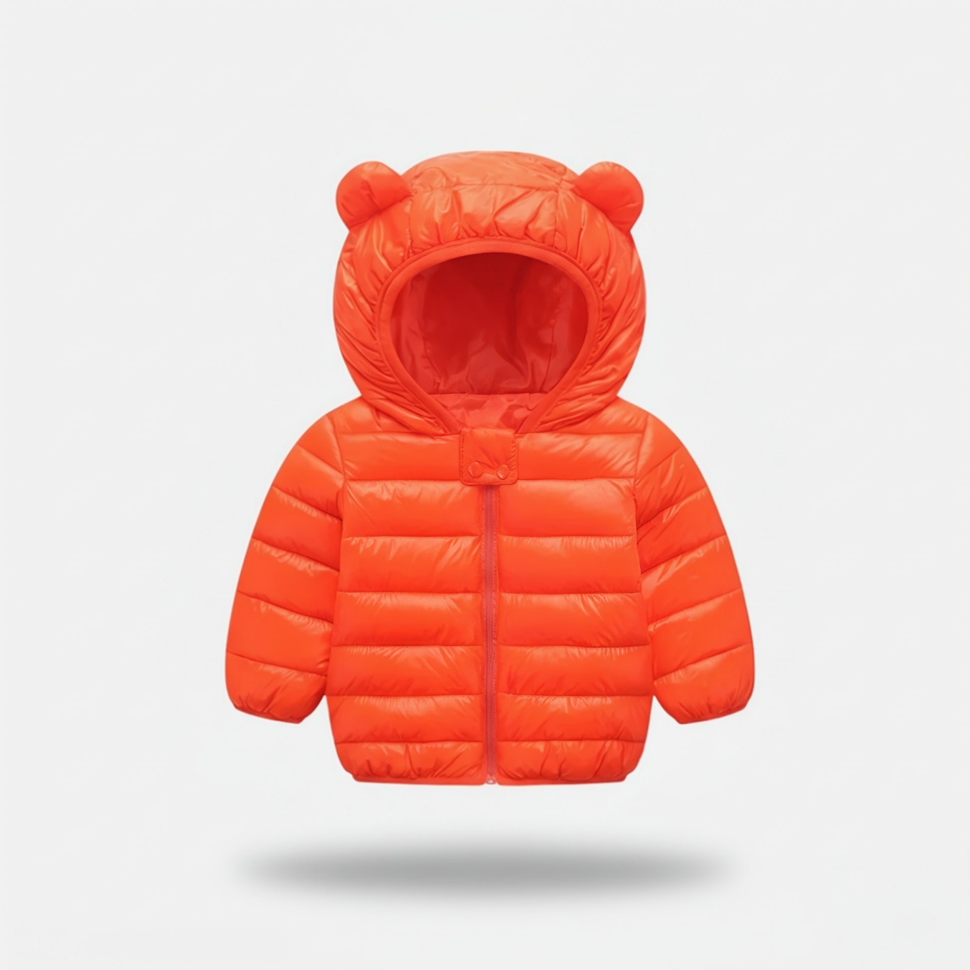 Orange children's puffer jacket with bear ears on a light gray background