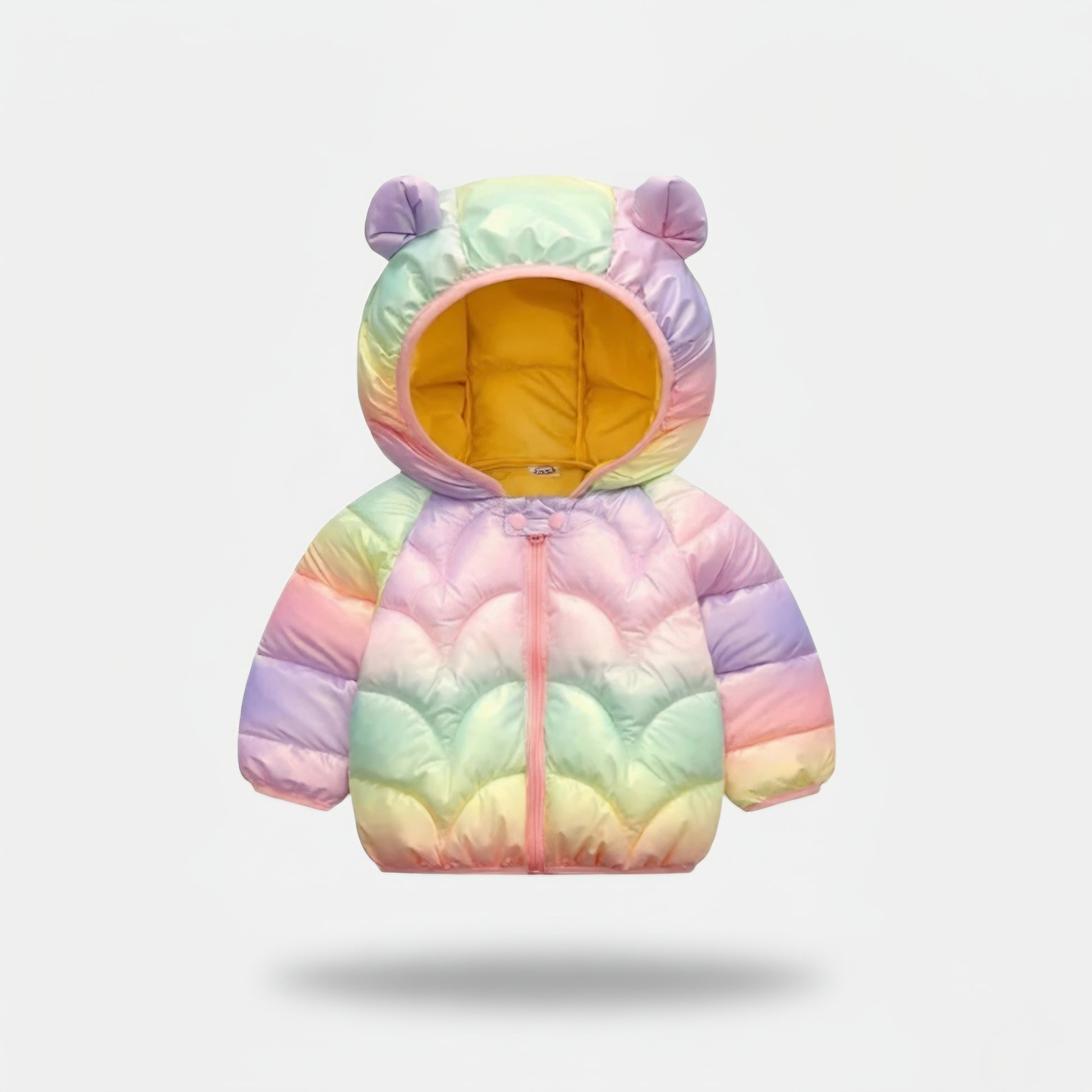 Pastel rainbow-colored children's puffer jacket with bear ears on a light gray background