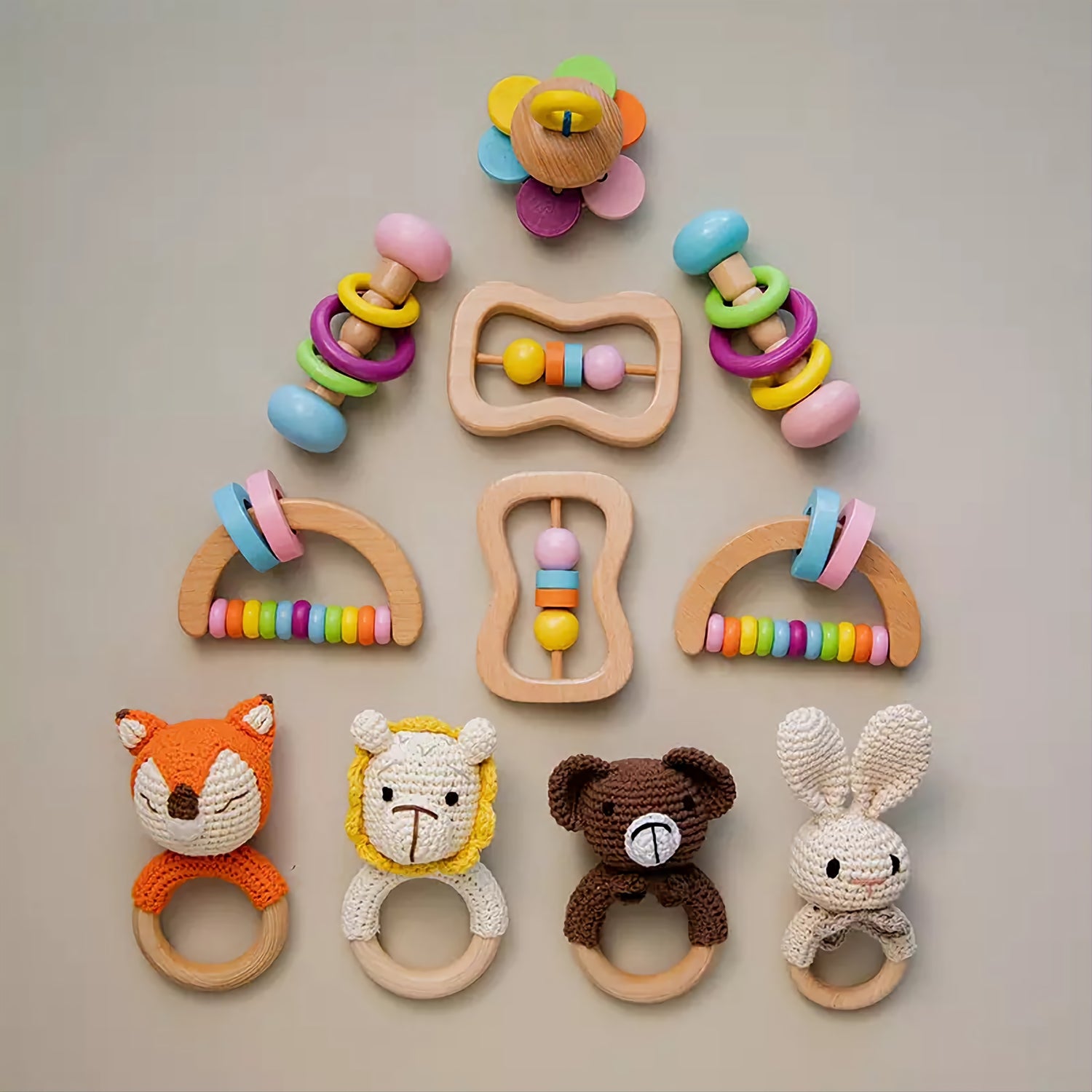 Colorful wooden montessori toy set for babies with animal rattles made of crochet and natural wood