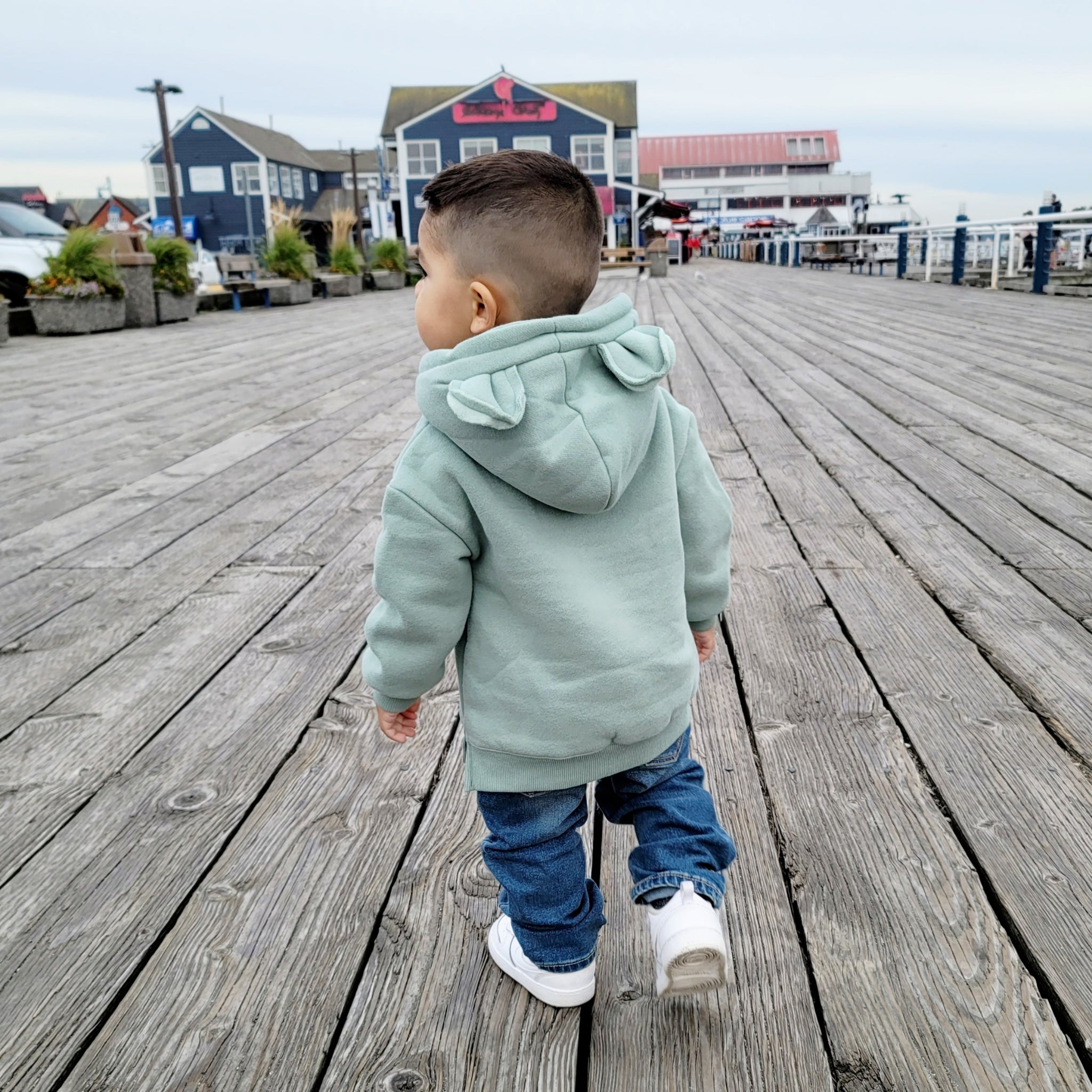 toddler wearing a green bear hoodie with ears - Hunny Bubba Kids