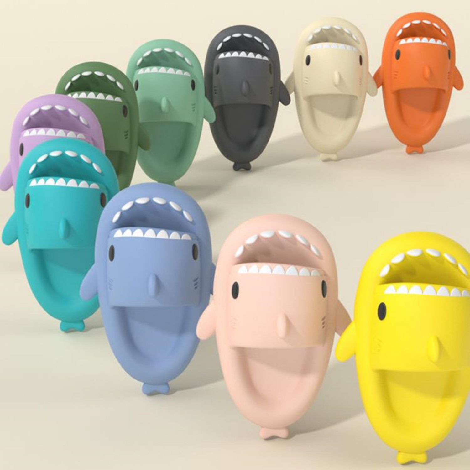 kids shark slipper being displayed in a line in different colors