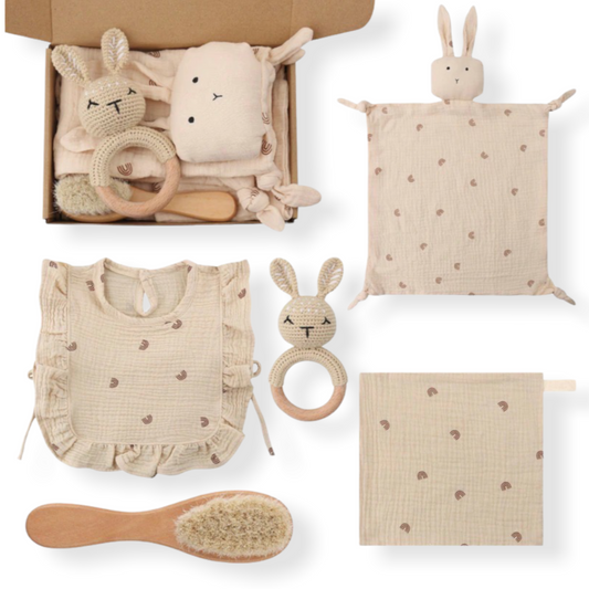 five piece newborn baby gift set in a box with rattle, swaddle, hair brush, bib