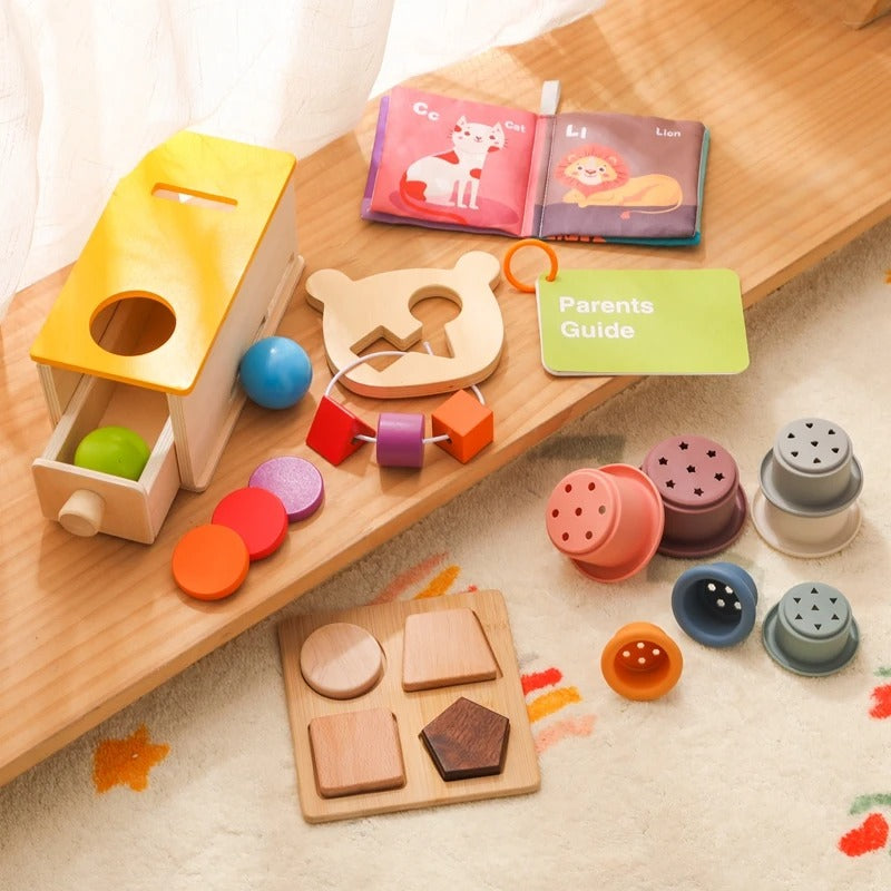 Wooden Montessori baby toy set displayed in a nursery play area