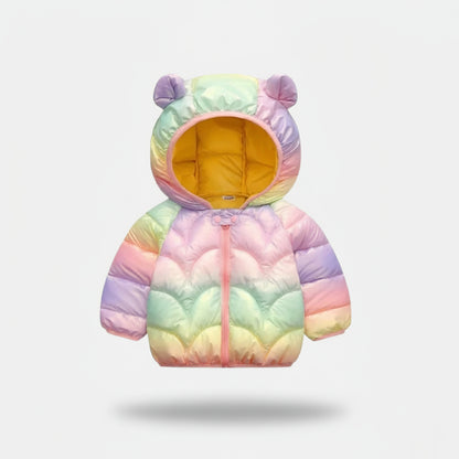Pastel rainbow-colored children's puffer jacket with bear ears on a light gray background