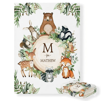 Woodland-themed baby shower invitation with animals and 'M' for Mathew text
