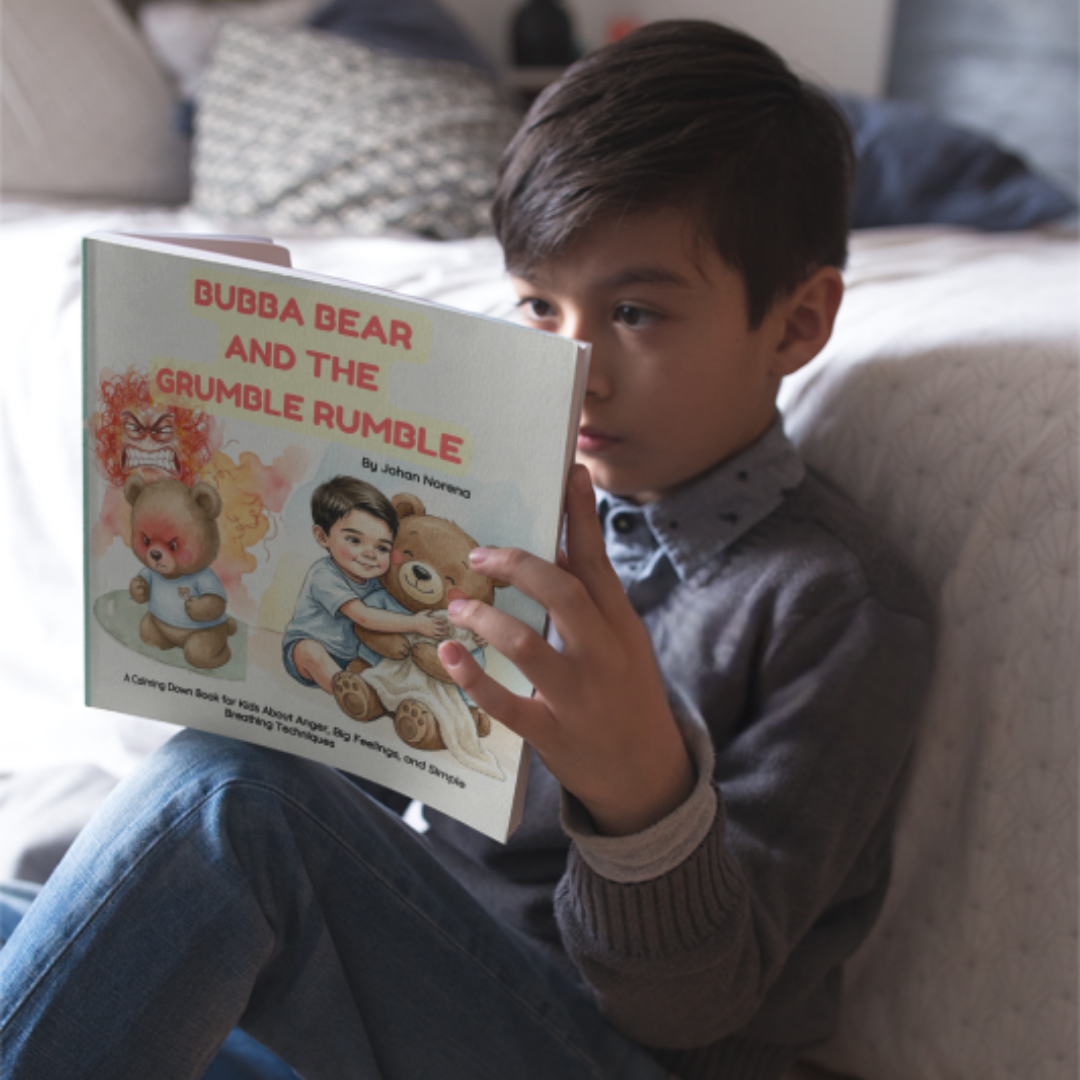 Child holding a book titled 'Bubba Bear and the Grumble Rumble' on a couch.