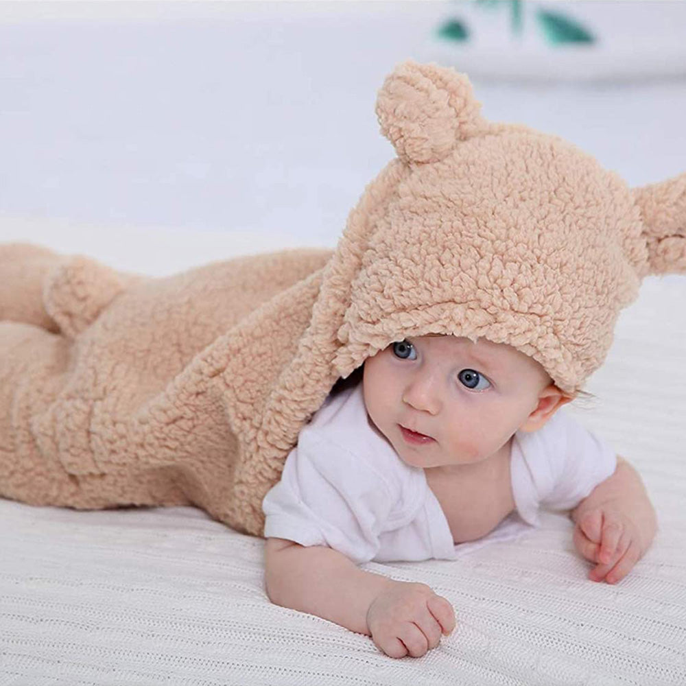 cute baby in a warm sherpa baby sleeping sack 