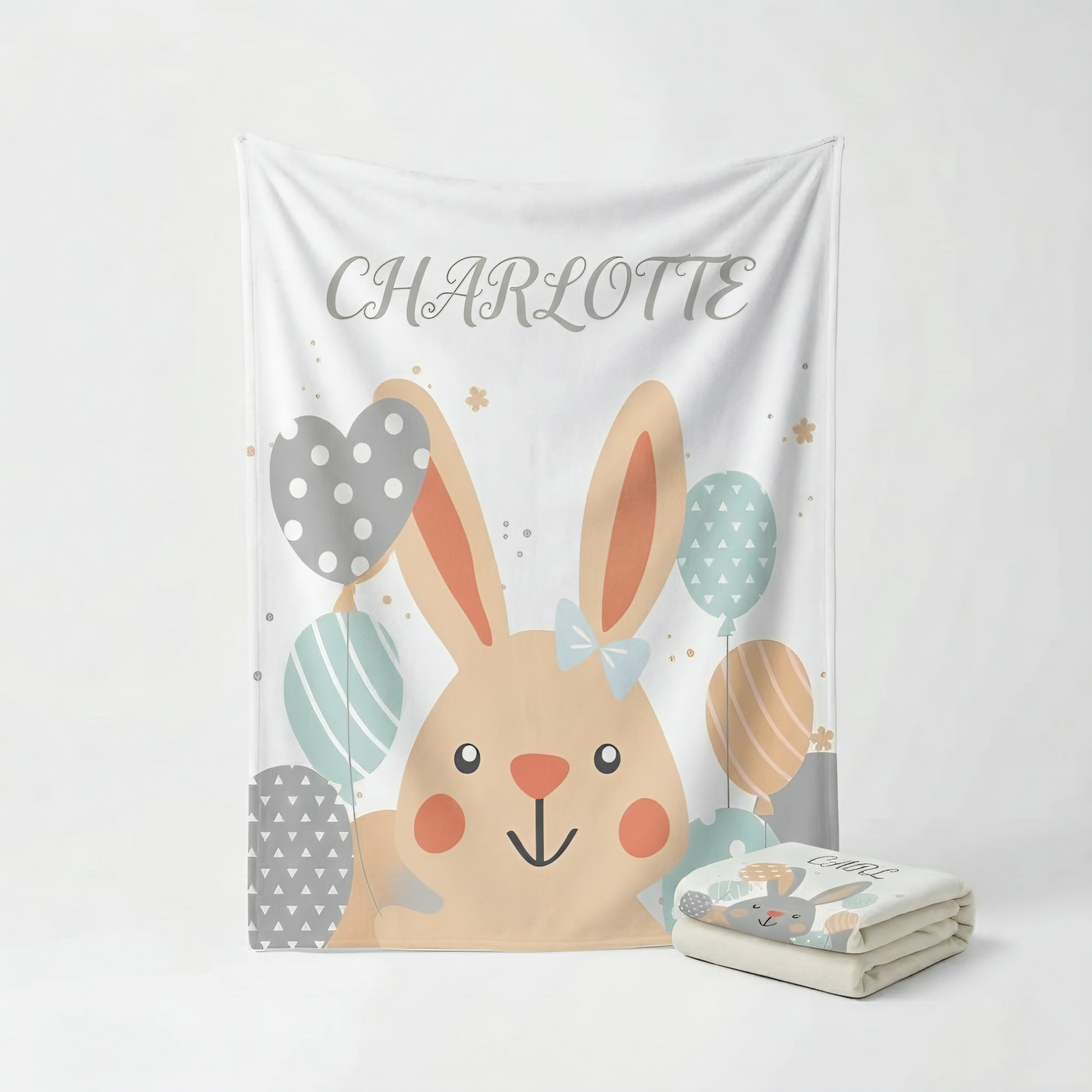 Children's blanket with a bunny design and personalized name on a white background