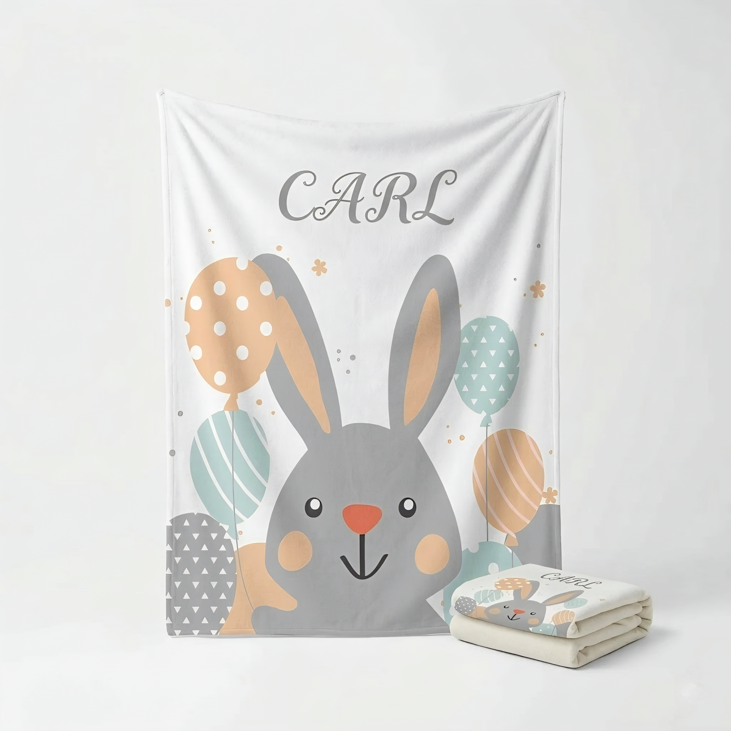 Children's blanket with a cartoon bunny and Easter eggs design, featuring the name 'Carl'.