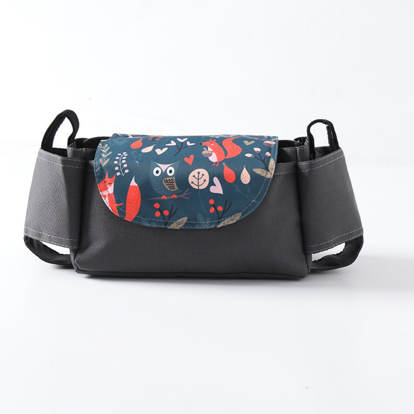 black stroller organizer bag and cup holder with woodlands animals print on a white background