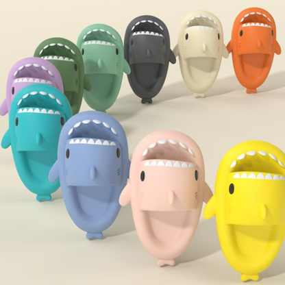 kids shark slipper being displayed in a line in different colors