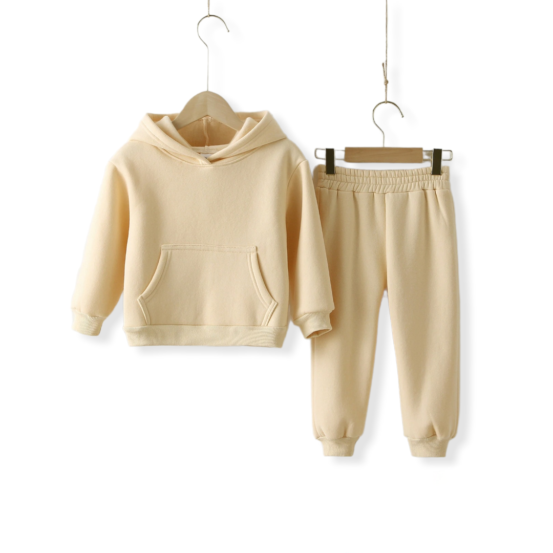 beige warm tracksuit set for toddlers and kids hung on a hanger for display on a white background