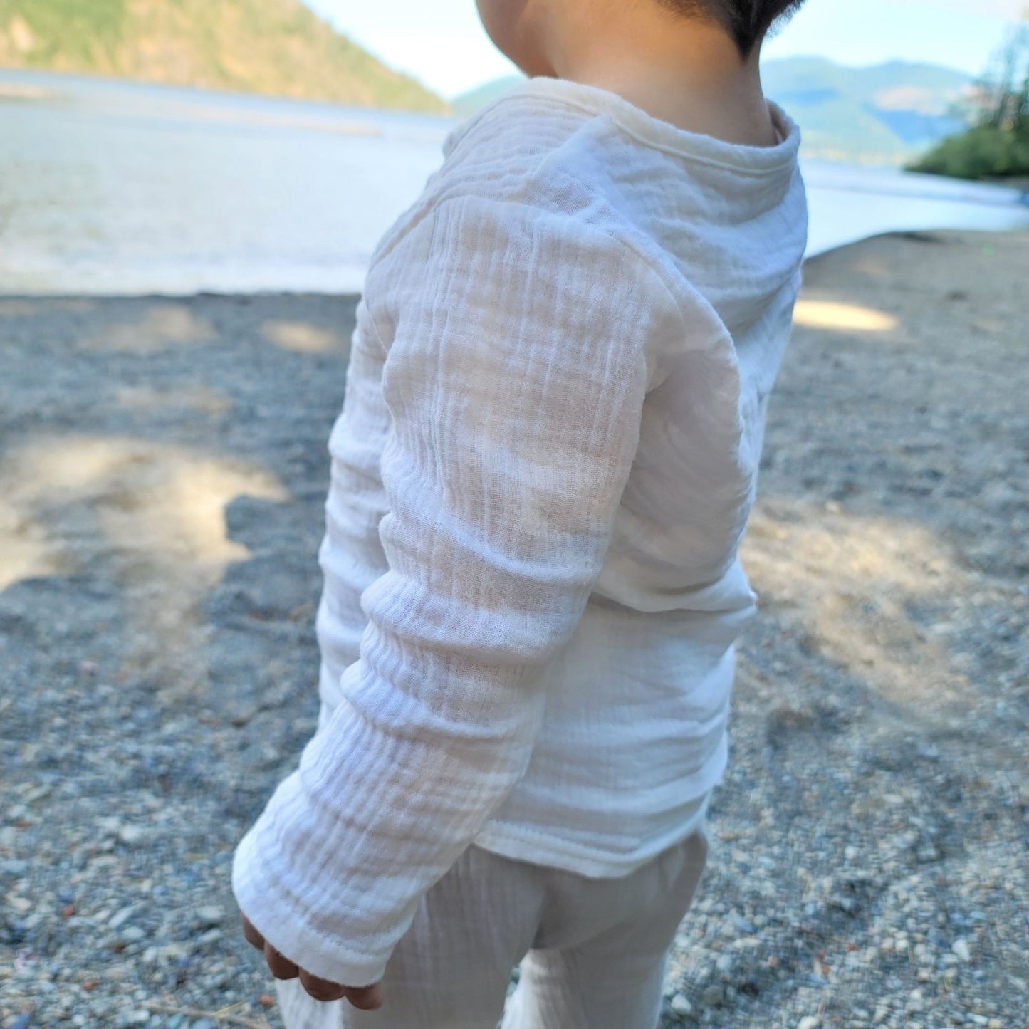 kid wearing at the leake a long sleeve summer linen shirt for toddlers and kids- hunny bubb akids