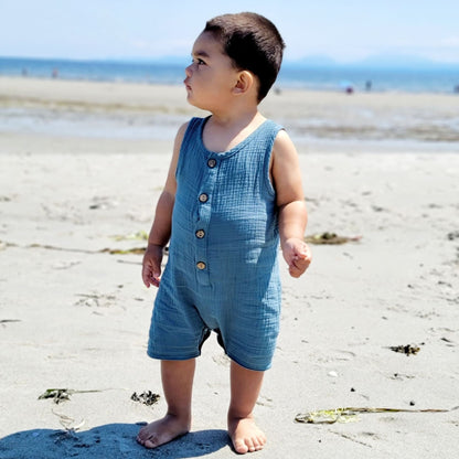 Baby wearing a cute blue romper at the beach- hunny bubba kids