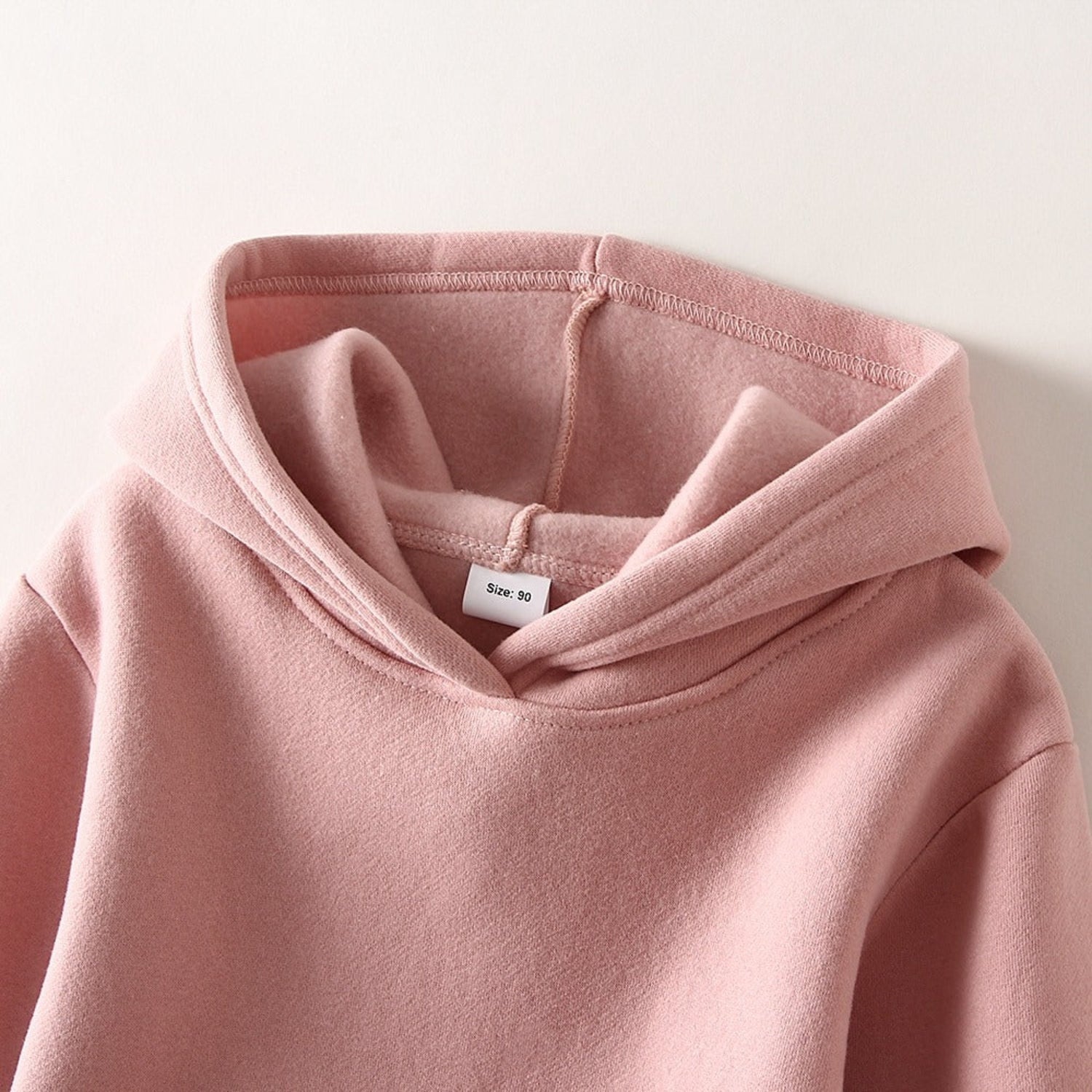 a pink gender neutral pullover hoodie for kids and toddlers from hunny bubb akids
