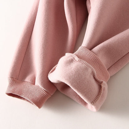 close up of the sleeve of a pink warm unisex tracksuit set for kids and toddlers