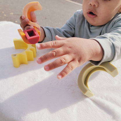 baby playing with Silicone sun stacking toy - hunny Bubba kids